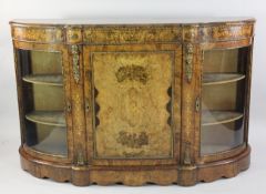 A Victorian walnut marquetry inlaid and ormolu mounted credenza, with bow end glazed doors and