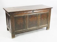 An 18th century oak coffer, with triple panel front and moulded stiles, W.4ft 2.5in.