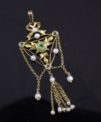 A late Victorian 9ct gold, peridot and seed pearl drop pendant necklace, of open triangular design