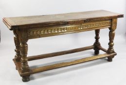 An early 18th century Spanish walnut draw leaf table, with chip carved decoration and initials to