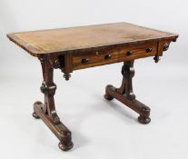 An early Victorian mahogany library table, with brown leather and gilt tooled skiver, over two