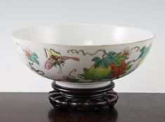 A Chinese famille rose `butterfly and melon` bowl, Daoguang mark and of the period, the exterior