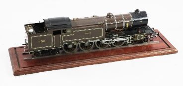 A scratch built live steam 4-8-4 locomotive, painted with brown and black livery and marked