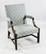 A George III mahogany Gainsborough chair, with moulded swept back arms and square section legs