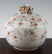 A Japanese Kutani porcelain covered bowl, 19th century, painted with blossoming branches, the domed