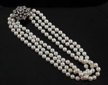 A 1950`s/1960`s triple strand cultured pearl choker necklace with detachable gold and diamond