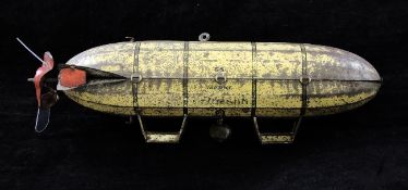 A Lehmann 651 red and gold tinplate airship, 7.75in.