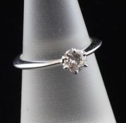An 18ct white gold solitaire diamond ring, the round brilliant cut stone weighing approximately 0.