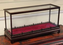 A Chinese rectangular table top display case, with fret pierced gallery and lift off top, 29in.