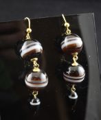 A pair of 9ct gold and banded agate drop earrings, with spherical and tapering drops, 2in.