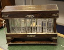 An unusual 19th century French and silvered brass mounted eight bottle decanter, each glass