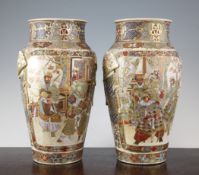 A pair of Japanese Satsuma baluster vases, Meiji period, each modelled with fan shaped handles with