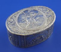 A late 19th century Hanau 800 standard oval silver snuff box, embossed with panels of putti and