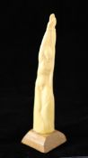 Angela Pruden - Ditchling School, a carved walrus ivory tusk, the base inscribed `The Martyr by