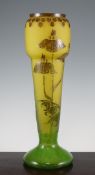 A large Schneider cameo glass vase, in yellow and green mottled glass overlaid with brown flowers