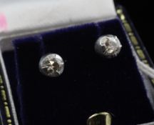 A pair of 18ct gold and diamond ear studs, the collet set stones with an estimated total diamond