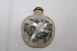 A Chinese dendritic crystal snuff bottle, 1760-1860, the front carved in relief with two horses
