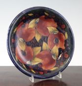 A Moorcroft Pomegranate dish, c.1950, inscribed WM and impressed marks, 8.75in.