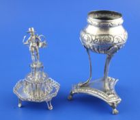 A continental novelty silver toothpick holder modelled as a graduated three tier stand with figural