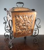 An Arts & Crafts embossed copper and wrought iron coal box, with tapering square body, 19in.