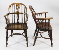 A set of four ash and elm Windsor armchairs, each with a central shaped pierced splat and turned