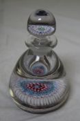 A millefleur glass inkwell paperweight, early 20th century, with seven concentric rings of cane to