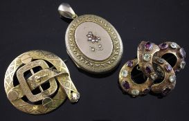 A Victorian gold and garnet set ""knot"" brooch, a Victorian circular gold ""belt & buckle brooch