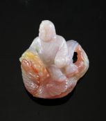 A Chinese chalcedony carving of an immortal riding a mythical fish, 4.2cm.