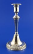 A 19th century Venetian cast silver candlestick, with tapering knopped stem and acanthus leaf