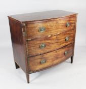 A George III mahogany bow front chest, with three long drawers and square tapering supports, W.3ft