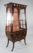 An Art Nouveau mahogany and marquetry inlaid display cabinet, with single glazed door, glazed sides