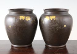 A pair of Japanese gold and silver inlaid bronze vases, Meiji period, each decorated with