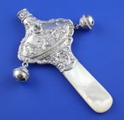 A late Victorian silver and mother of pearl child`s rattle, with two bells, mother of pearl teether