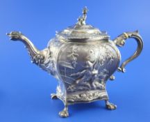 A George II Scottish silver teapot, of bombe shape, embossed with Dutch and chinoiserie scenes