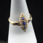 An Edwardian 18ct gold, sapphire and rose cut diamond marquise shaped ring, size N.