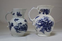 Two Worcester cabbage leaf mask jugs, c.1770, one printed in underglaze blue with a `Pine Cone`