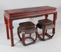 A late 19th / early 20th century chinoiserie red lacquer altar table, with key border and floral
