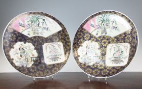 A pair of Japanese enamelled porcelain dishes, Meiji period, each painted with reserves of ladies