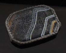 A 19th century Persian silver mounted banded agate plaque engraved with Islamic script, of