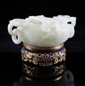 A Chinese pale celadon jade brush washer, Qianlong six character mark but later, of compressed