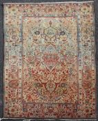 An early 20th century central Persian `Mohtashem` Kashan rug, with field of scrolling foliage and