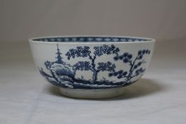 A Worcester `Cannonball` pattern bowl, c.1770, printed in underglaze blue with a design of pagoda,