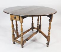 An 18th century and later oak oval gateleg table, with single drawer, on turned supports, W.4ft