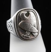 A 1980`s Georg Jensen for The Franklin Mint sterling silver ring, decorated with eagle and Celtic