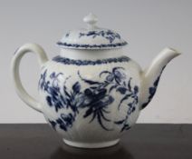 A Worcester `Feather Moulded` pattern teapot, c.1756-60, painted underglaze blue floral motif