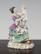 A Meissen group of a mother holding a baby, c.1900, modelled by Auguste Ringer, on a scroll work