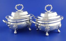 A pair of George III silver two handled sauce tureens and covers, of rounded rectangular form, with