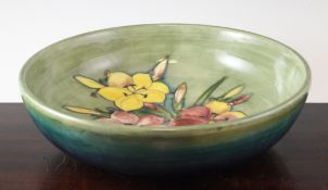 A large Moorcroft Freesia pattern bowl, c.1935, with pale green to blue graduated ground, inscribed