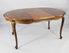 A late 19th / early 20th century French oval extending dining table, with parquetry inlaid top, one
