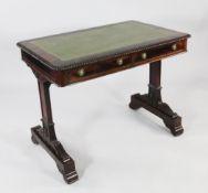 A George IV rosewood writing table, c.1825, the rectangular top inset green leather skiver with